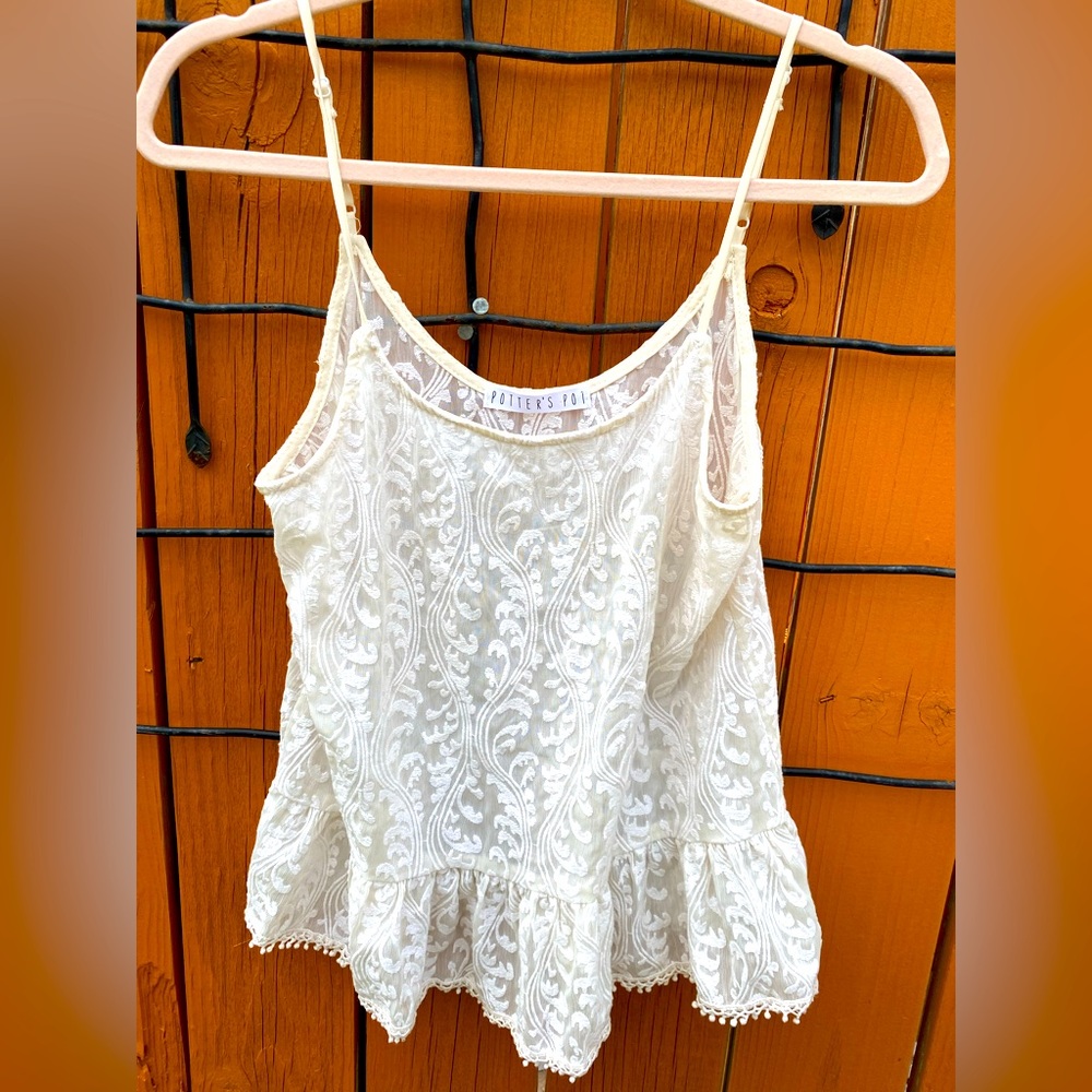 Lace sleeveless peplum blouse
